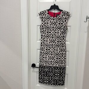 Gorgeous dress. Cap sleeve. Black and white. Size 8.  Zip up the back